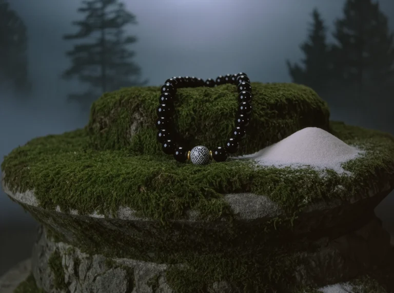 The Altar of Time: Why Ancient Stones Ground the Modern Soul 2 Ancient Stones by Yuano: A sacred obsidian and Dzi bead relic resting on a mossy altar of time.