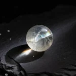 Divine Imperfection: A clear quartz relic by Yuano featuring internal fissures and celestial rainbow inclusions.