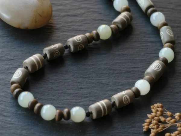 Covenant No. 04 — Ancient Wisdom Primary Narrative Covenant No. 04: Ancient Wisdom hand-knotted necklace featuring Tibet Dzi and Xinjiang Nephrite Jade.
