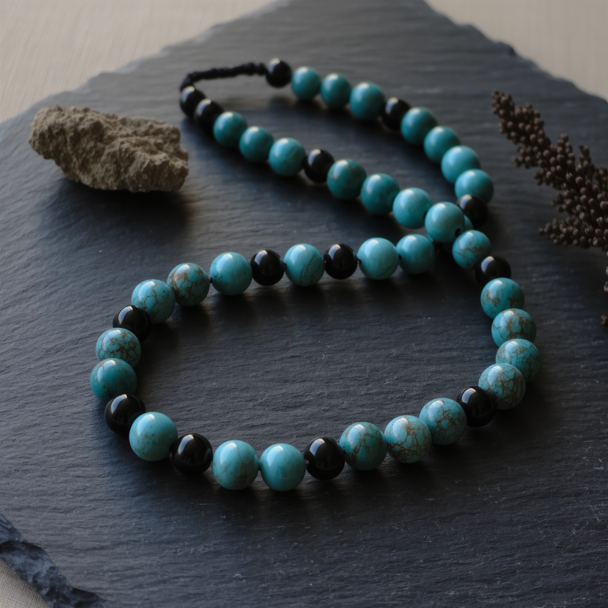 Covenant No. 09: Third Eye hand-knotted necklace featuring Hubei Turquoise and Tibet Obsidian.