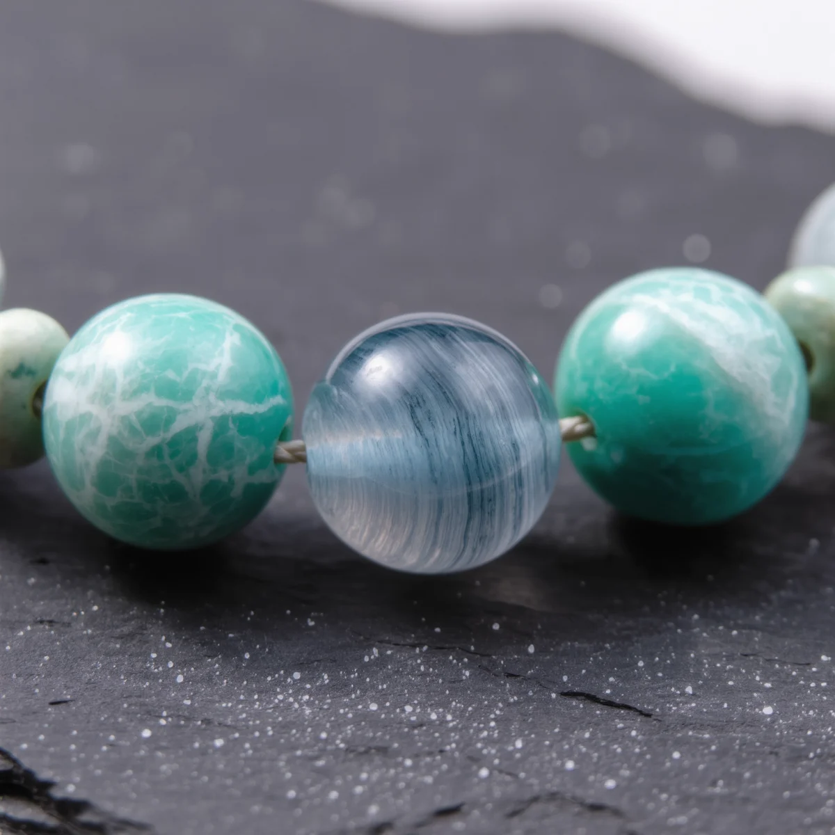 Fluidity No. 08 — Crystalline Material Witness Fluidity No. 08 macro detail showing the ethereal silk patterns of Ili Blue Agate and the webbed texture of Fujian Amazonite.