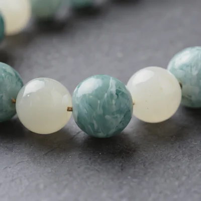 Fluidity No. 04 — Macro Material Witness Fluidity No. 04 macro detail highlighting the vibrant turquoise-green energy of Fujian Amazonite and the oily luster of Xinjiang Nephrite Jade.