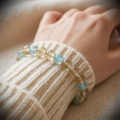 Fluidity No. 05 — Lifestyle Radiant Perspective Fluidity No. 05: River of Stars bracelet worn by a model, demonstrating its radiant shimmer against a white knitted sweater.