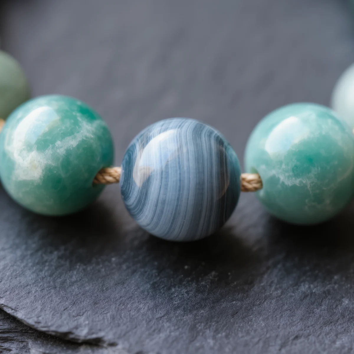 Fluidity No. 06 — Macro Material Witness Fluidity No. 06 macro detail highlighting the fine white stripes of Blue Silk Agate and the organic textures of Amazonite.