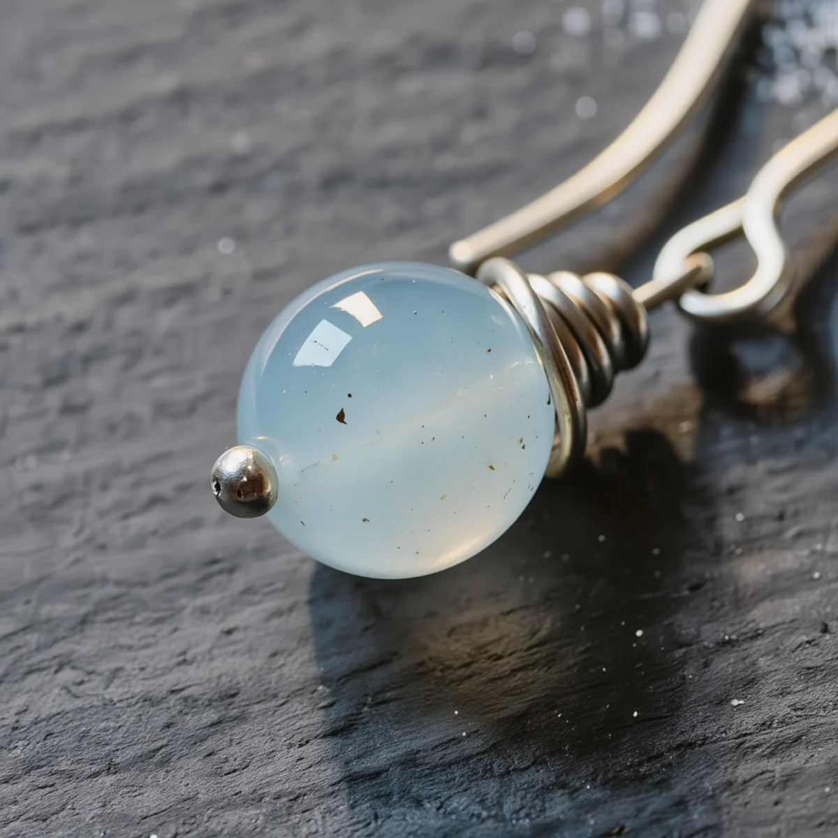 Fluidity No. 07 — Macro Material Witness Fluidity No. 07 macro detail highlighting the ice-like natural inclusions of Xinjiang Aquamarine and fine silver craftsmanship.