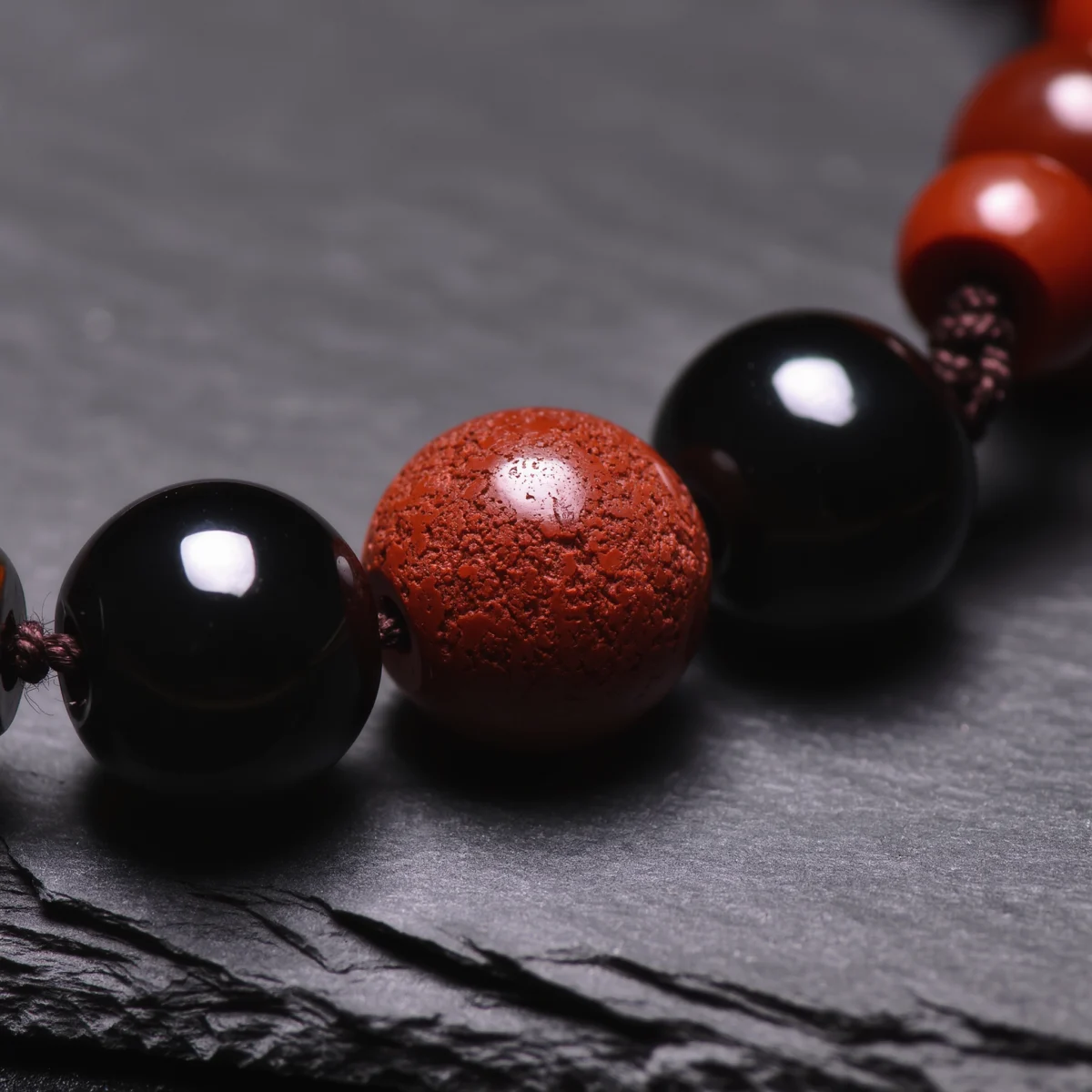 Fortress No. 01 — Mineral Fortification Detail Fortress No. 01 macro detail revealing the pitted texture of Cinnabar and glassy luster of Obsidian.