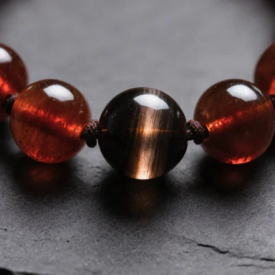 Fortress No. 02 — Mineral Fortification Detail Fortress No. 02 macro detail revealing the cat's eye chatoyancy of Black Tiger Eye and the internal glow of Garnet.