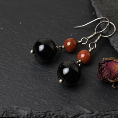 yuano-fortress-no-03-eternal-guard-earrings-obsidian-cinnabar-main.webp Fortress No. 03: Eternal Guard hand-knotted earrings featuring Tibet Obsidian and Guizhou Cinnabar.