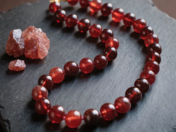 Fortress No. 04 — Ember Guard Primary Narrative Fortress No. 04: Ember Guard hand-knotted necklace featuring Xinjiang Garnet and Sichuan Nanhong.