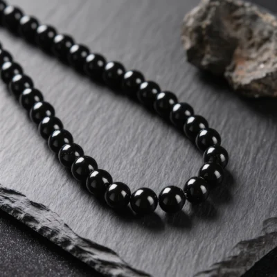 Fortress No. 09 — Obsidian Wall Primary Narrative Fortress No. 09: Obsidian Wall hand-knotted necklace featuring Tibet Obsidian and Black Agate.