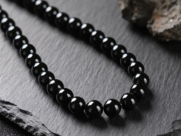 Fortress No. 09 — Obsidian Wall Primary Narrative Fortress No. 09: Obsidian Wall hand-knotted necklace featuring Tibet Obsidian and Black Agate.