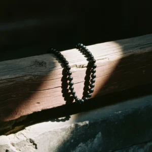 About Us 6 Handcrafted Jewelry by Yuano: The artisan's hand in a state of prayerful observation.