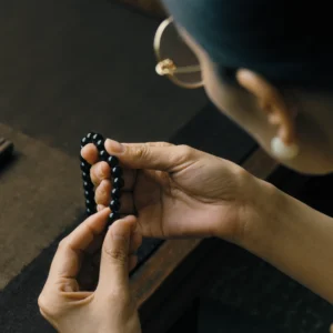 About Us 5 Handcrafted Jewelry by Yuano: The slow and rhythmic selection of obsidian beads.
