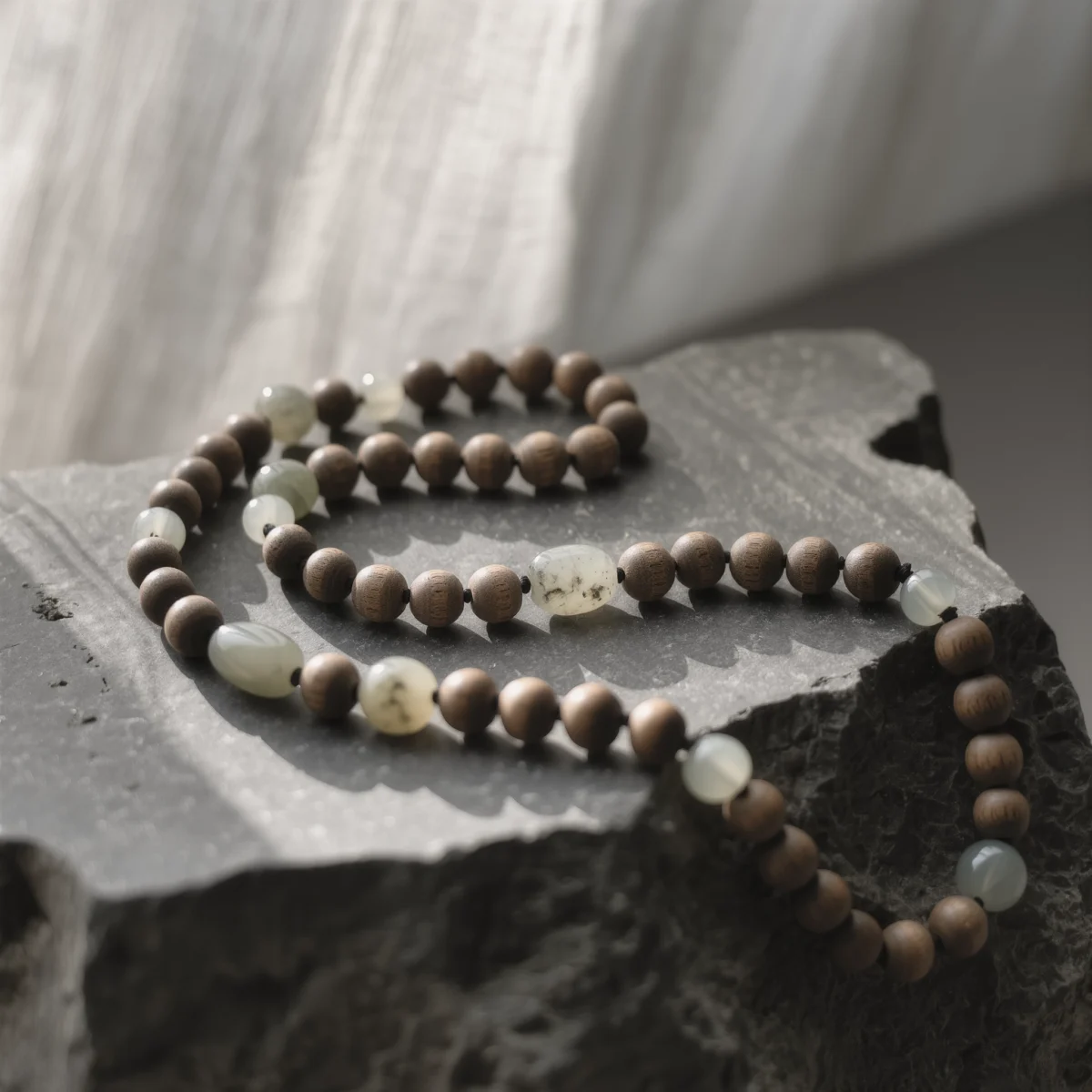 Origin No. 01 — The Relic of Ancient Soil Product Image Origin No. 01: Hand-knotted necklace featuring Xinjiang Nephrite Jade and Hainan Sandalwood by Yuano.