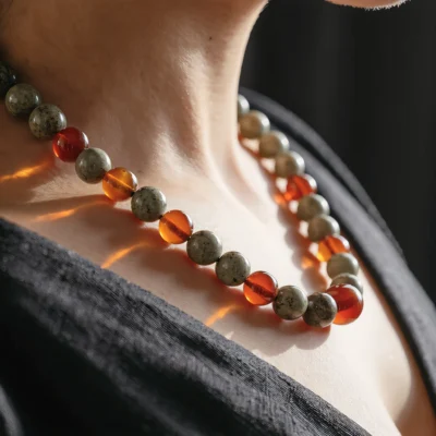 Origin No. 07 — Lifestyle Wearing View Origin No. 07: Stone Ritual necklace worn by a model, demonstrating the natural drape and spiritual presence against natural light.