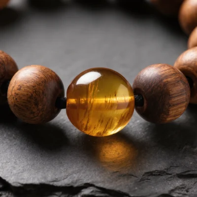 Radiance No. 06 — Mineral and Botanical Heart Detail Radiance No. 06 macro detail revealing the prehistoric inclusions in Fushun Amber and the ghost-face patterns of Hainan Rosewood.