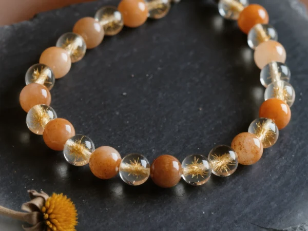 Radiance No. 07 — Eternal Sun Primary Narrative Radiance No. 07: Eternal Sun hand-knotted necklace featuring Inner Mongolia Sunstone and Donghai Rutilated Quartz.
