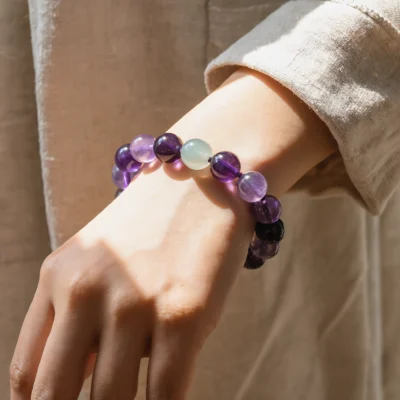 Serenity No. 09 — Lifestyle Observational Poise Serenity No. 09: Soft Stillness bracelet worn by a model in a linen garment with dramatic window light.
