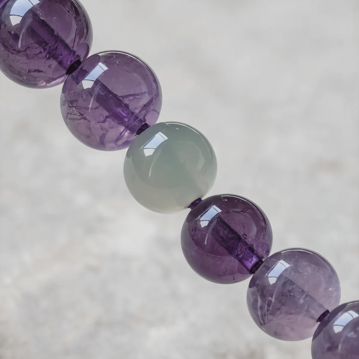 Serenity No. 09 — Mineral Equilibrium Detail Serenity No. 09 macro detail revealing the waxy luster of Hetian Jade and internal crystalline veils of Amethyst.