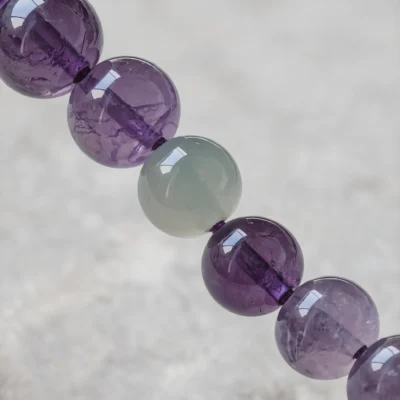 Serenity No. 09 — Mineral Equilibrium Detail Serenity No. 09 macro detail revealing the waxy luster of Hetian Jade and internal crystalline veils of Amethyst.